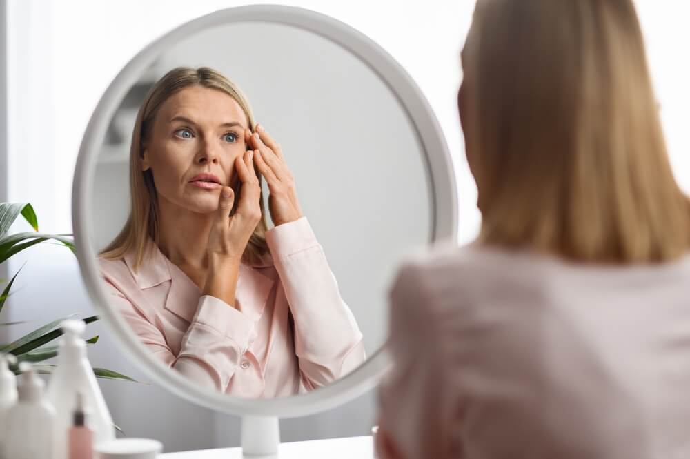 Middle-aged Woman with a concern about wrinkles and sagging skin