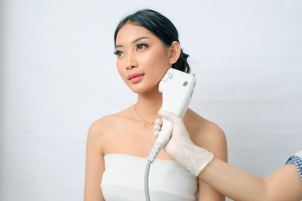 Close-up shot of woman under the HIFU facelift treatment process