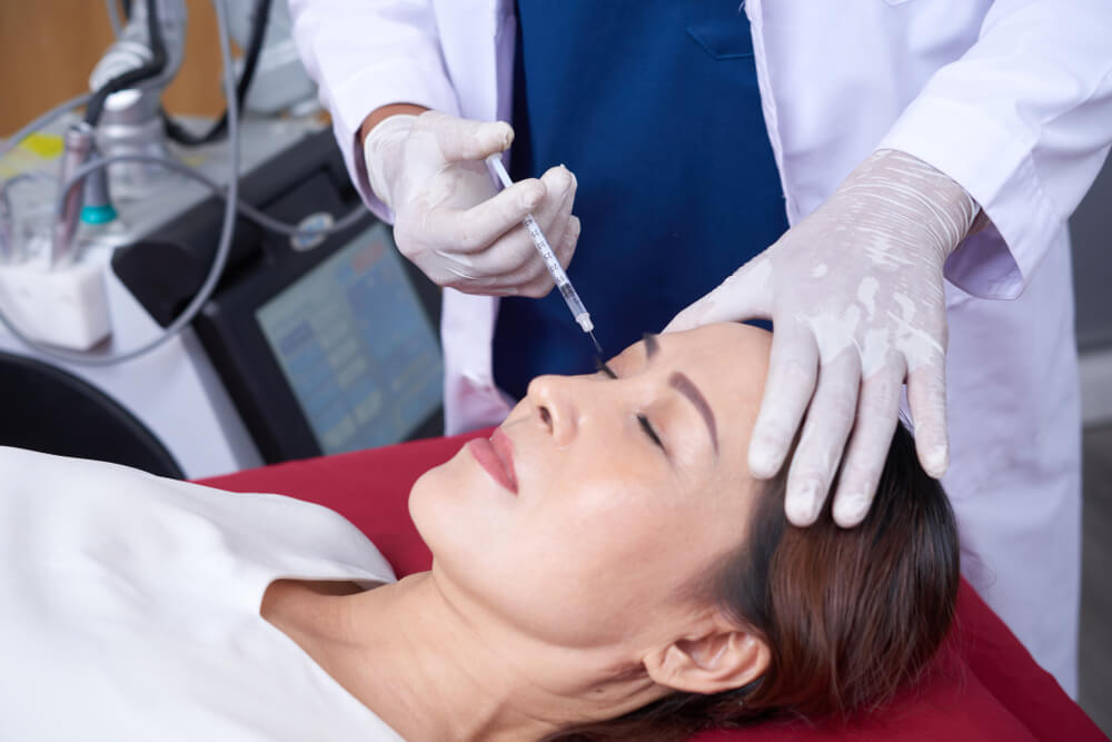 Middle-aged woman getting a Botox injection