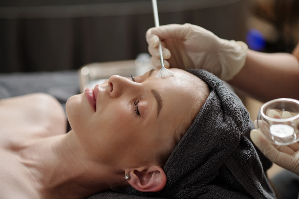Woman under the chemical peeling process
